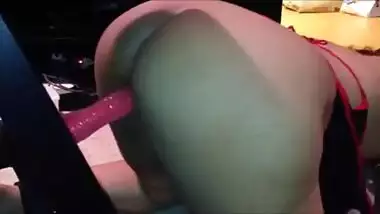 Indian slave cuffed and fucking a dildo