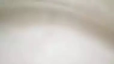 Indian holds a sex camera and touches her own XXX jugs and shaved slit
