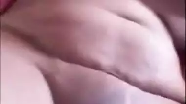 Indian chick in a red robe bares her natural XXX breasts to the sex fan