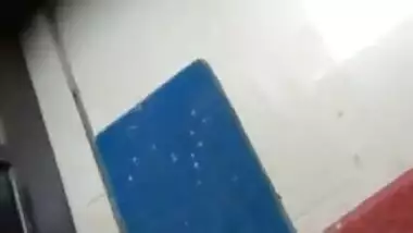 Boy rubbing his pennies infront of maid